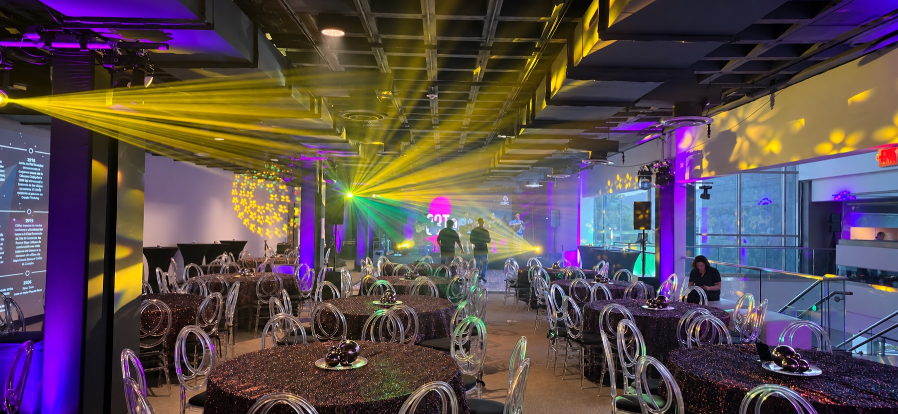 Golden beams and gobo lighting transform a ballroom