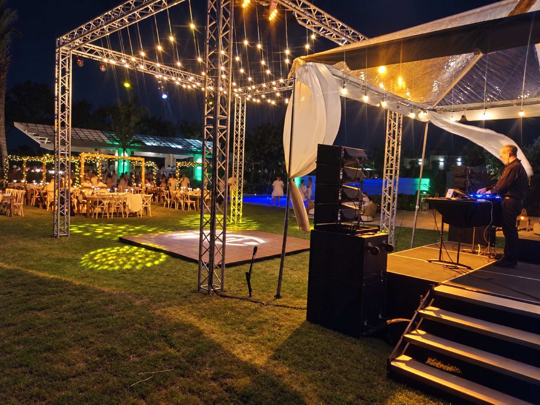 An outdoor sound and staging installation with an operator at the controls